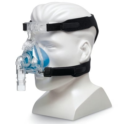 A mannequin head wearing a Respironics Comfort Gel Blue Nasal CPAP Mask.
