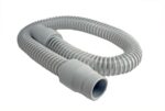 Gray flexible plastic hose with ridges and connectors at both ends on a white background.