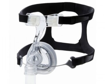 A CPAP nasal mask with black headgear straps and a clear plastic cushion and frame.