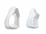 Two white, curved, hollow plastic objects with open centers, viewed from different angles on a white background.