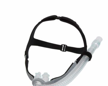 Black CPAP nasal mask with headgear and attached flexible hose on a white background.