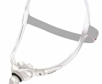 Clear CPAP nasal mask with white headgear and gray strap, featuring a hose connector at the front.