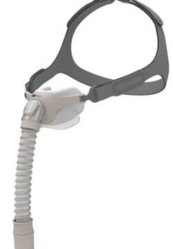 Nasal CPAP mask with gray headgear and a flexible tube for sleep apnea treatment.