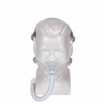 CPAP nasal mask with headgear and hose displayed on a mannequin head, front view.