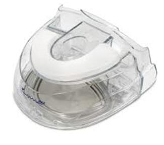 Clear plastic tape dispenser with a roll of tape inside, shown on a white background.
