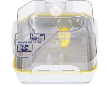 A clear plastic water chamber with a yellow seal and "Remove Tub to Fill" instructions on the lid.