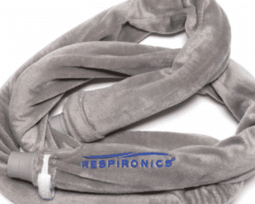 A gray, plush CPAP hose cover with the word “RESPIRONICS” and a blue wave logo on the fabric.