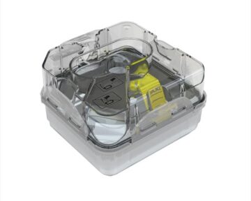 Clear plastic water chamber with a yellow latch, designed for a medical device such as a CPAP machine.