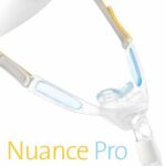 Close-up of a Nuance Pro nasal CPAP mask with headgear, showing soft cushions and blue accents.