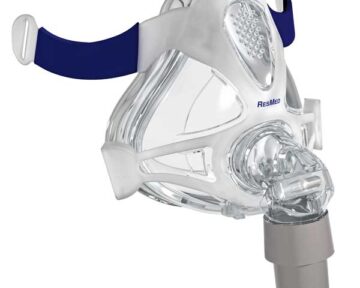 Clear CPAP face mask with blue head strap and ResMed logo, used for sleep apnea therapy.
