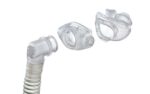 Clear CPAP mask parts and a flexible hose isolated on a white background.