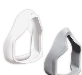 Two plastic, angular cookie cutters, one white and one gray, on a plain white background.