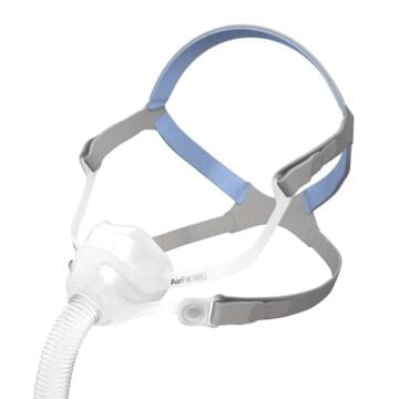 A gray and blue CPAP nasal mask with headgear and a hose attachment for sleep apnea therapy.