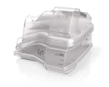 Transparent plastic water chamber for a CPAP humidifier, marked with a maximum fill line.