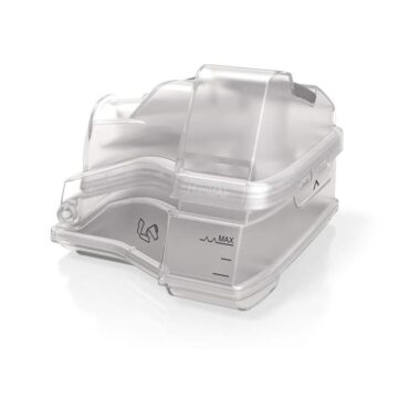 Transparent plastic water chamber for a CPAP humidifier, marked with a maximum fill line.