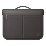 Black laptop sleeve with a handle and two front pockets, zipper on the left side, minimalist design.