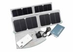 Portable foldable solar panel charging a smartphone and a power bank with connected cables on a white background.