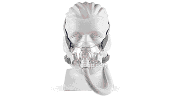 A mannequin head wearing a full-face CPAP mask with an attached hose, used for sleep apnea therapy.