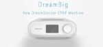 White DreamStation CPAP machine with display screen and round control knob, labeled "DreamBig.