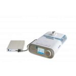 A CPAP machine connected to an external battery pack on a white background.