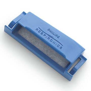 Blue Philips Respironics filter with a visible grey mesh inside, used for medical equipment.
