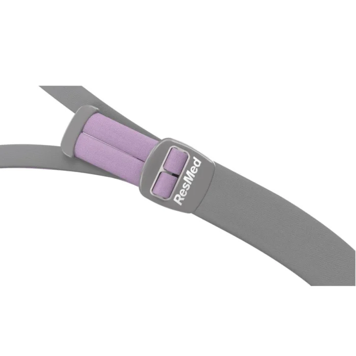 Fastened gray seatbelt with a purple patch displaying the word "reserved" for ResMed AirFit P10 For Her Nasal Pillow CPAP Mask (Fit Pack).