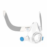 Clear full-face CPAP mask with gray and white straps and blue accents, shown on a white background.
