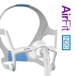 Gray and blue ResMed AirFit N20 CPAP nasal mask with headgear, hose attached, and product name on the side.