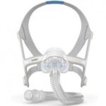 CPAP mask with headgear and tubing attachment, designed for sleep apnea therapy, shown on a white background.