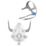Clear CPAP mask and gray headgear straps with blue accent, shown separately on a white background.
