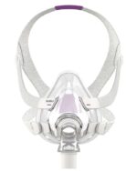 Clear CPAP face mask with grey straps and purple accents, viewed from the front.