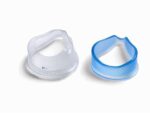 Two silicone CPAP mask cushions, one clear and one blue, placed side by side on a white background.