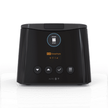 A black F&P SleepStyle CPAP machine with control buttons and a digital display on the front.