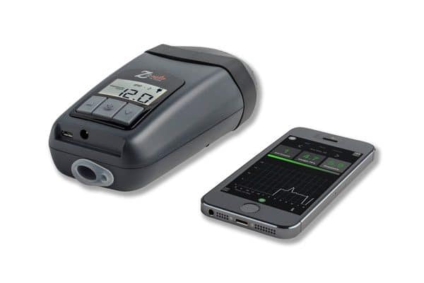 An HDM Z2 Travel Auto CPAP Machine next to an electronic device.