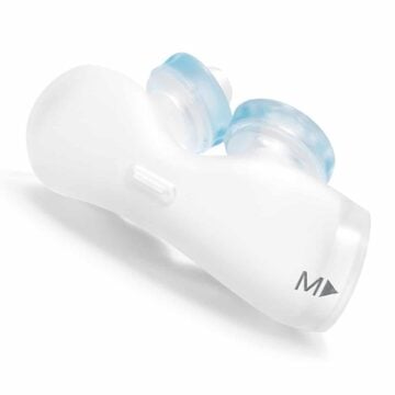 White and blue nasal dilator device labeled "M" on one end, designed to fit inside the nostrils.