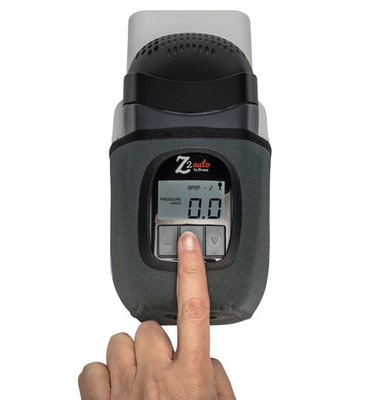 A person is holding a HDM Z2 Travel Auto CPAP Machine.