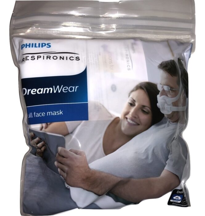 A Philips DreamWear full face mask package shows a couple relaxing; the man wears a CPAP mask.