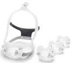 Clear CPAP mask with adjustable straps and three interchangeable cushion sizes (small, medium, large).