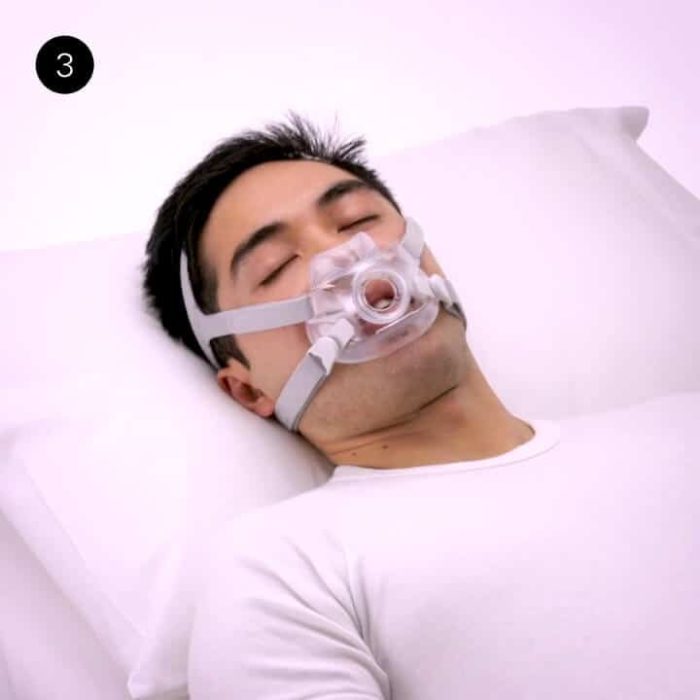 A man wearing the ResMed AirFit F30 Full Face CPAP Mask while sleeping.
