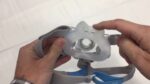A person is holding a ResMed AirFit F30 Full Face CPAP Mask.