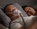 A man and woman using the ResMed AirFit F30 Full Face CPAP Mask while sleeping.