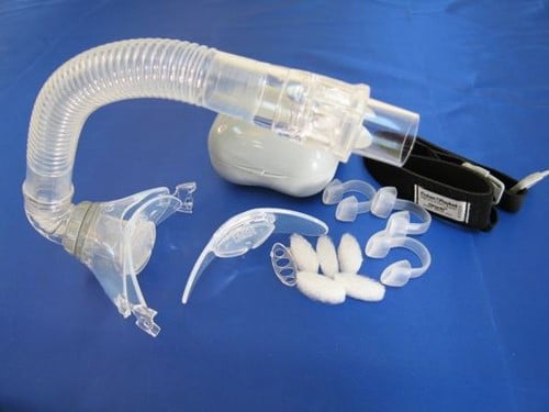 A nasal pillow Fisher & Paykel Oracle 452 Oral CPAP Mask (Fit Pack) machine with a hose attached to it.