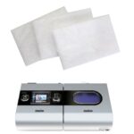 A machine with a white sheet of paper on top of it, compatible with ResMed Airsense S10 & S9 Hypoallergenic CPAP Filter (5 Pack).