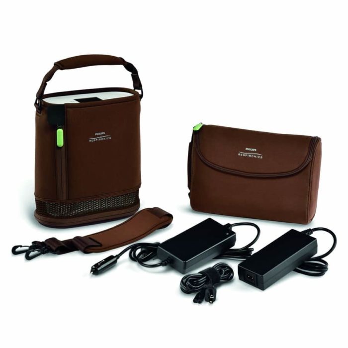 A Respironics Simply Go Mini Portable Oxygen Concentrator with Extended Life Battery with a charger.