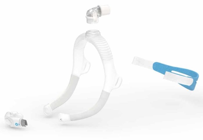A white and blue ResMed AirFit P30i Nasal Pillow CPAP Mask on a white background.
