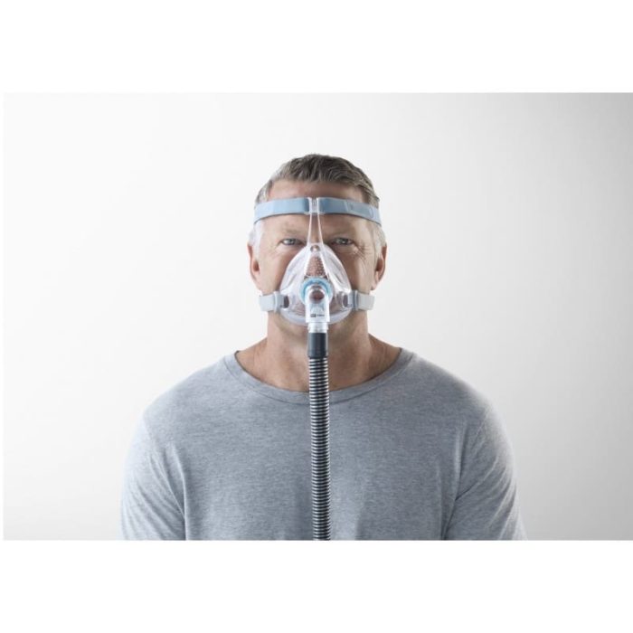 A man wearing a Fisher & Paykel Vitera Full Face CPAP mask.