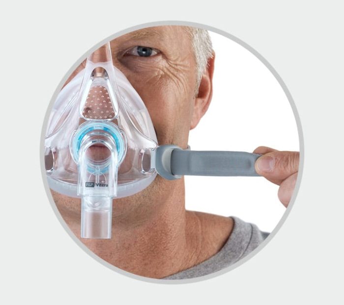 A man wearing a Fisher & Paykel Vitera Full Face CPAP Mask.