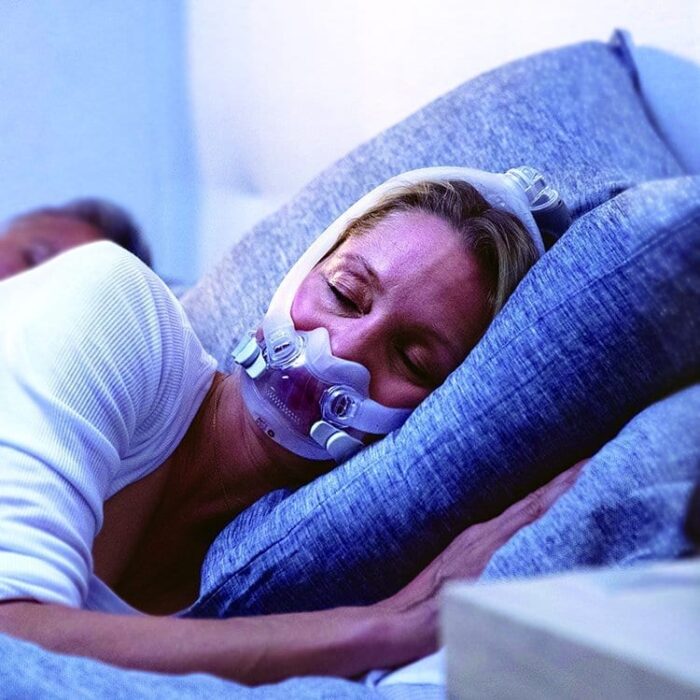 A woman using the ResMed AirFit F30i Full Face CPAP Mask while sleeping was observed.