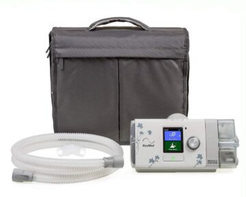 A ResMed AirSense S10 Autoset for Her APAP Machine with HumidAir Humidifier with hoses and a bag, available at a discount from CPAPSupply.ca.