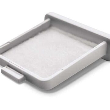 A white plastic Respironics Dreamstation Go container with a white cover for Respironics Dreamstation Go Washable/Reusable CPAP Filters (2 Pack).